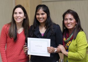 Young artist receiving certificate of appreciation