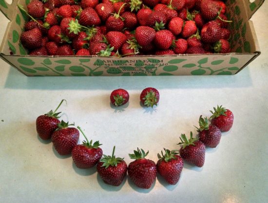 Smiley face made with strawberries