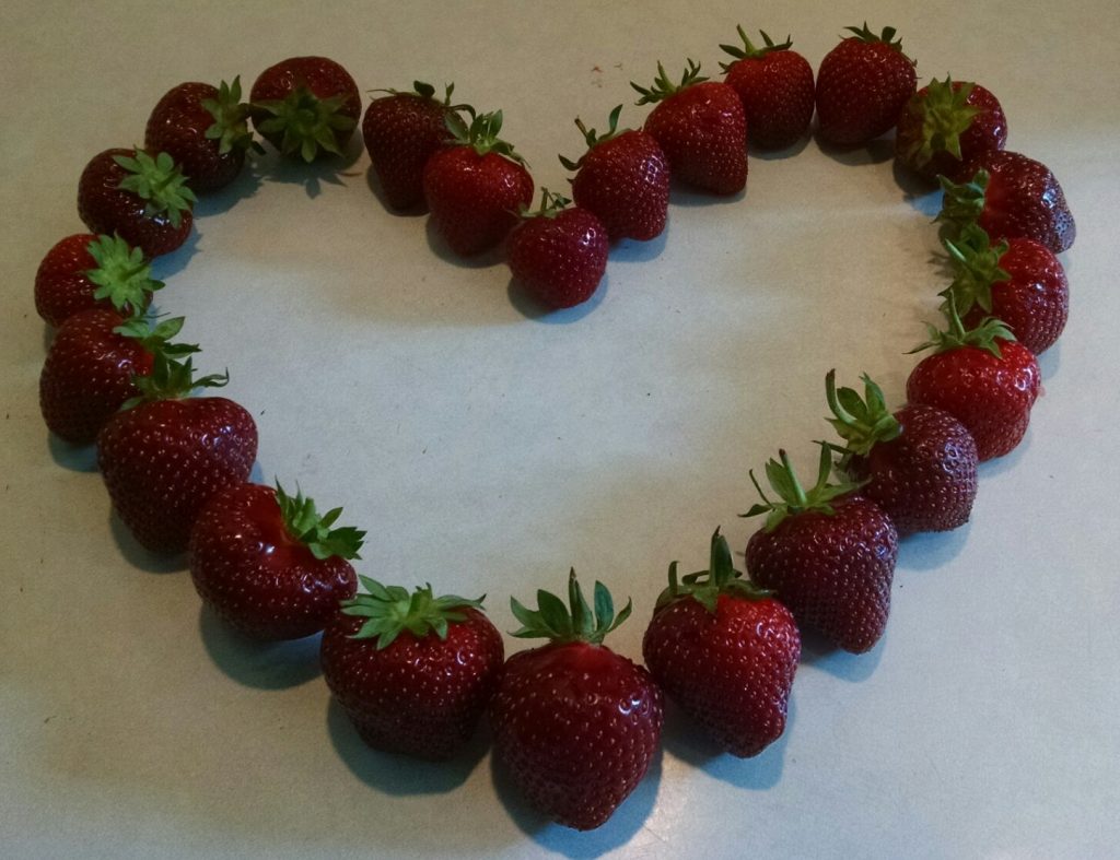 A heart shaped from strawberries