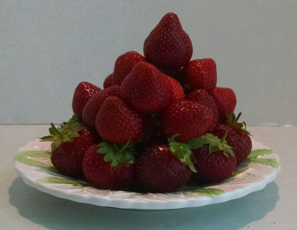 a pyramid made from strawberries