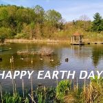 pond with sign saying Happy Earth Day!