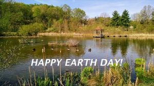 pond with sign saying Happy Earth Day!